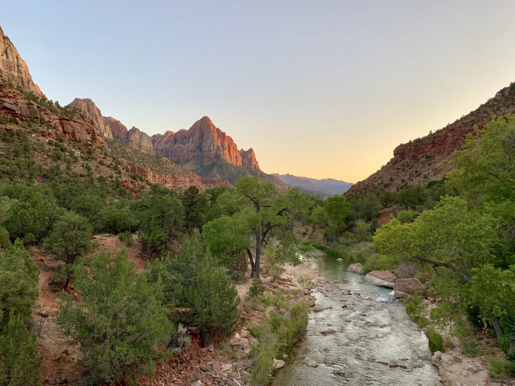 Sunset from Canyon Junction Bridge in Zion NP with Virgin River and mountain horitzontal