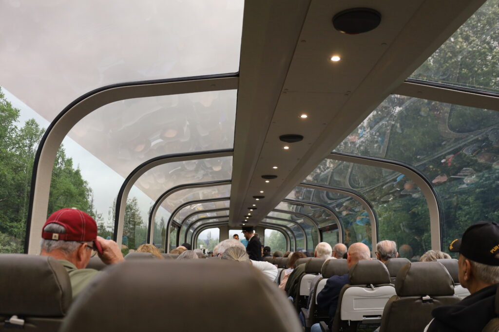 View of glass domed train and passengers